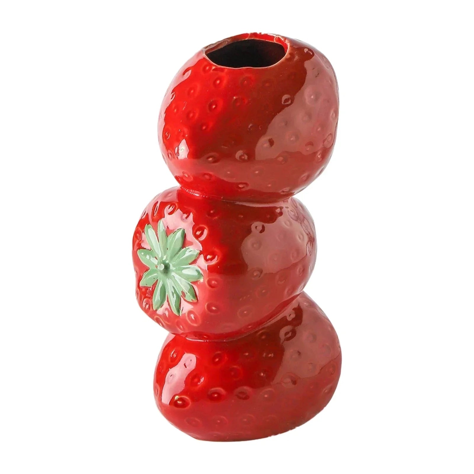 A red ceramic strawberry-shaped vase designed as unique fruit-themed home decor.