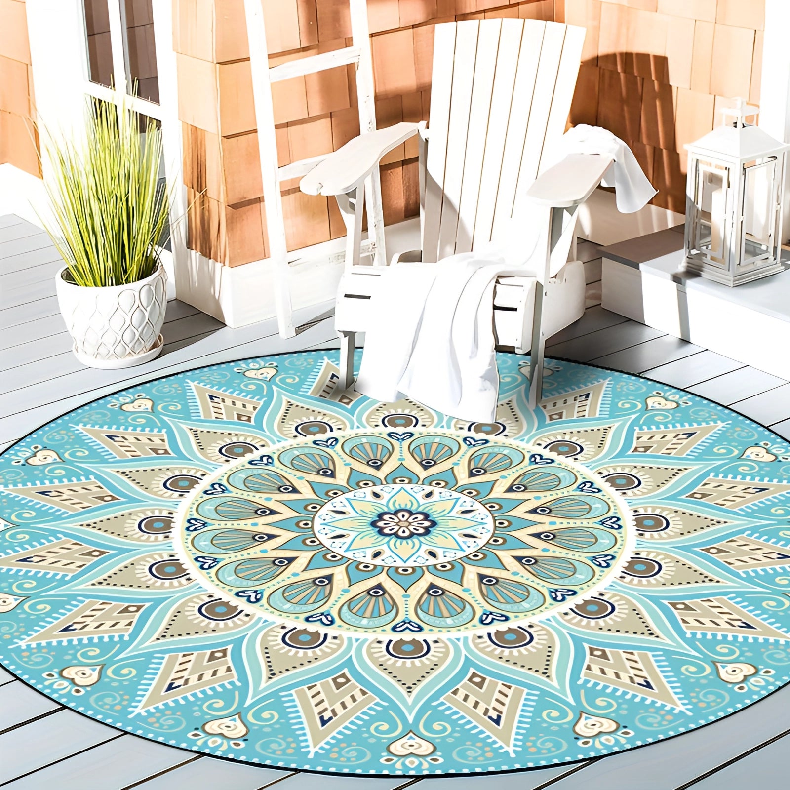 Round blue mandala rug with intricate bohemian design and turquoise color, placed on a wooden floor in a room with furniture and greenery.