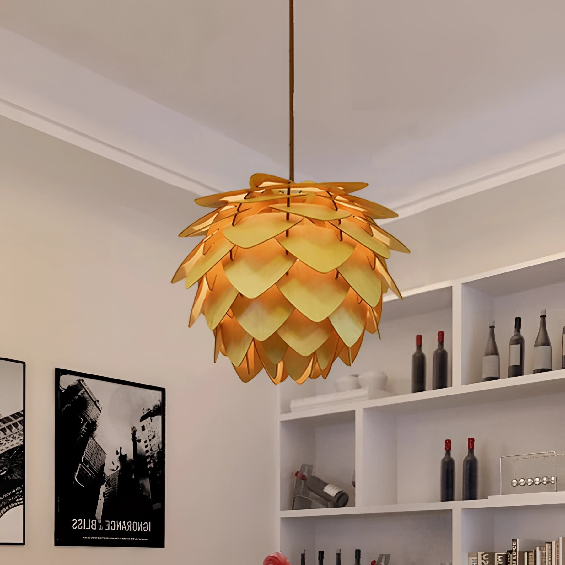 Scandinavian Pinecone Pendant Light in a modern organic style, measuring 68cm, hanging from the ceiling in a well-designed interior space with wooden accents and framed art on the walls.