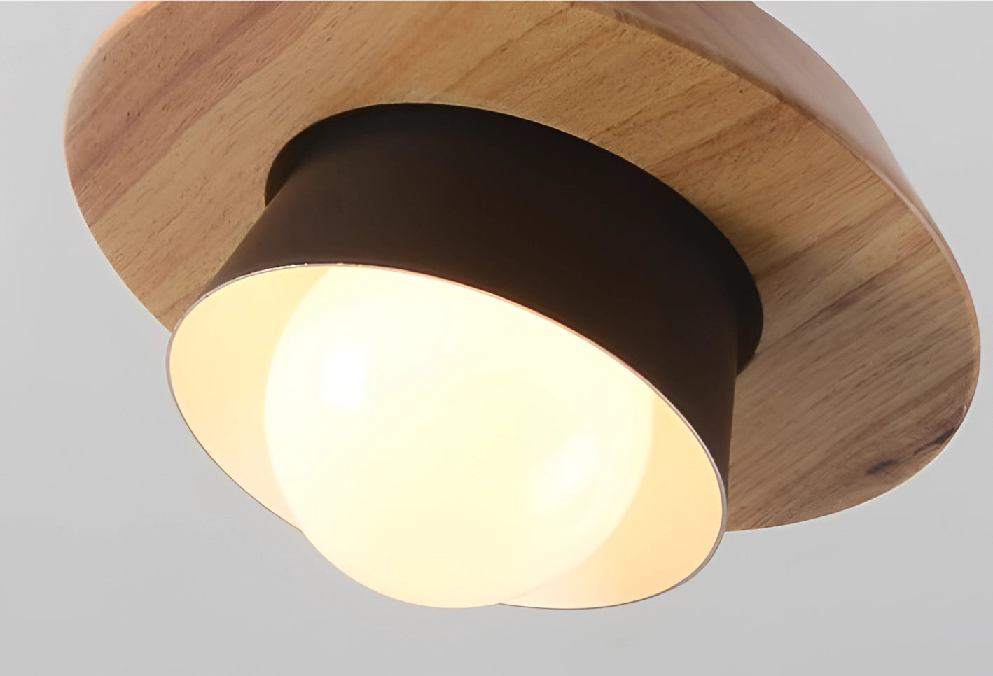 Scandinavian wooden pendant light with a circular beige plywood lampshade, designed as a modern eco-friendly ceiling fixture.