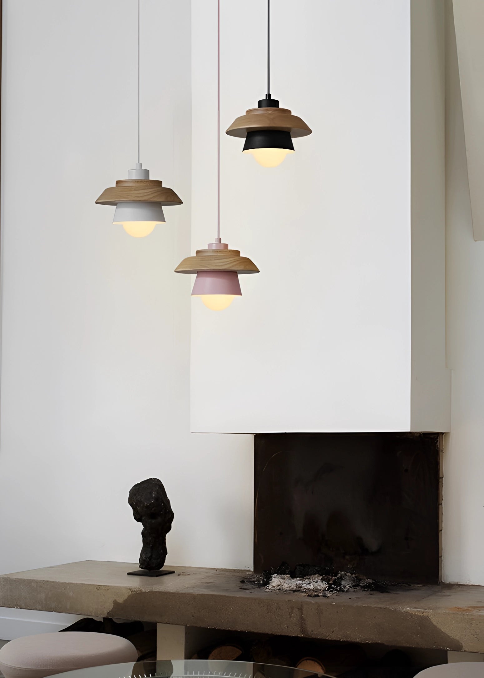 Scandinavian Wooden Pendant Light hanging from the ceiling, featuring a modern eco-friendly design with a natural wood finish, enhancing the interior architecture and design. A glimpse of a plant in the background adds to the aesthetic ambiance.