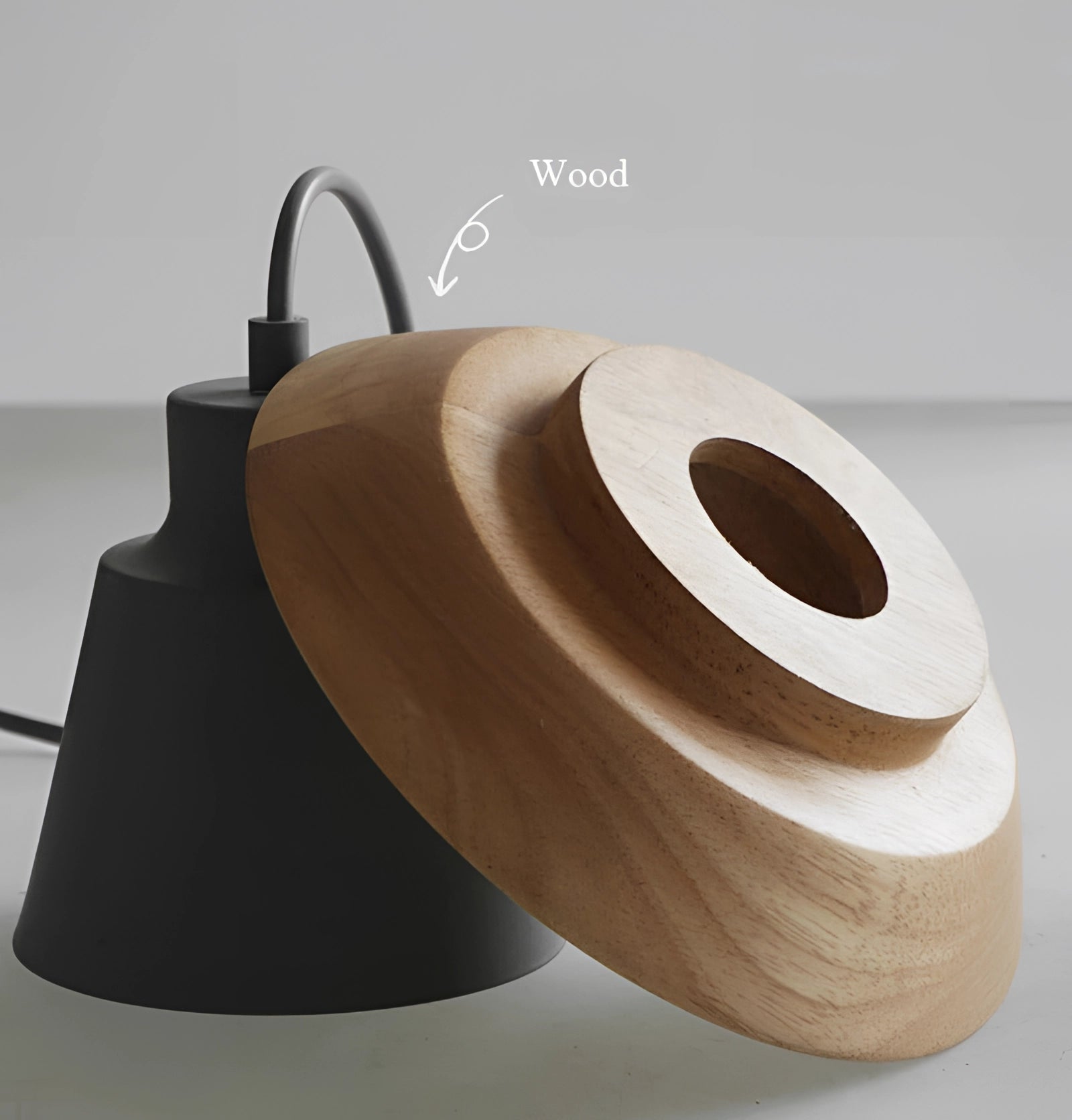 Scandinavian wooden pendant light with a modern eco-friendly design, featuring a circular shape and beige wood finish, hanging from a ceiling above a minimalist table setting.