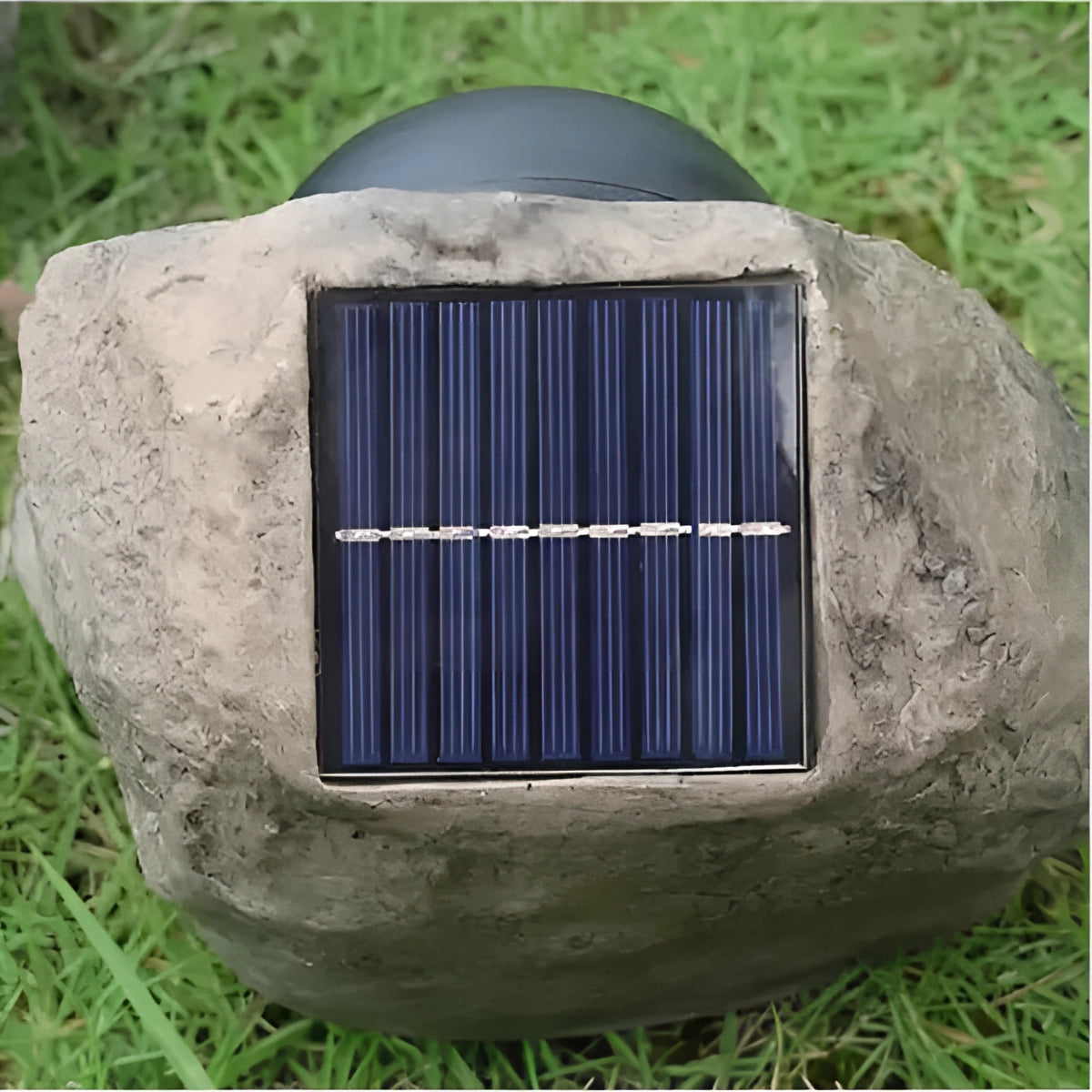 Solar-powered LED rock lights illuminating a garden area with decorative plants and grass, showcasing their waterproof and outdoor-friendly design.