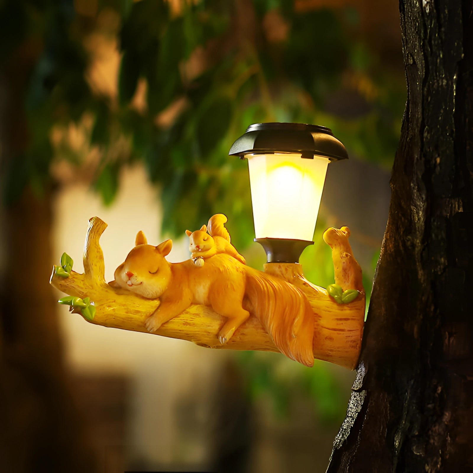 Squirrel-shaped solar garden lamp with LED light, featuring a whimsical squirrel design perched on a faux tree trunk with twig details, perfect for outdoor settings and garden decor.