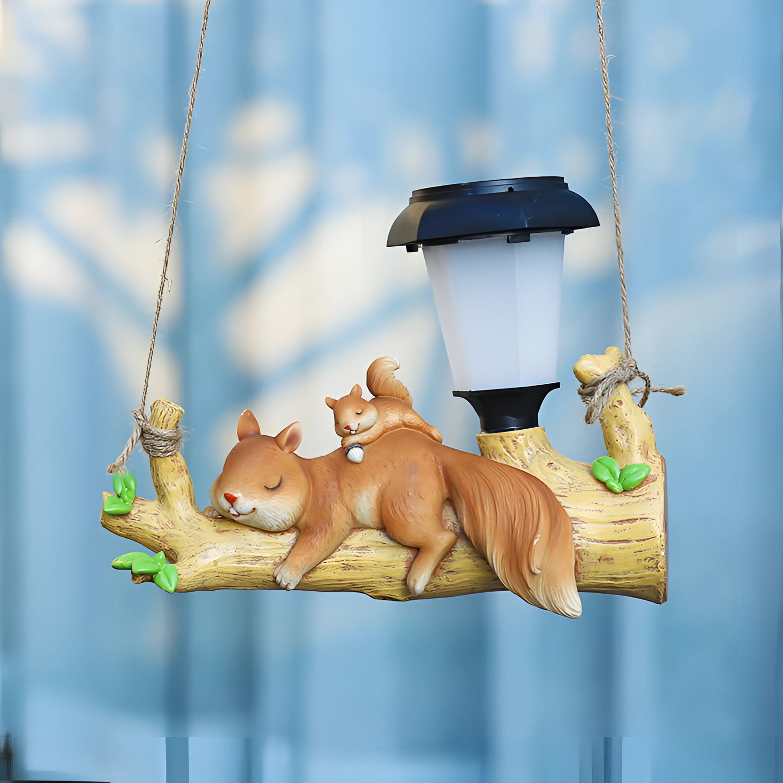 Squirrel-shaped solar garden lamp featuring a lifelike design with a bushy tail, ideal for outdoor decor and garden illumination.