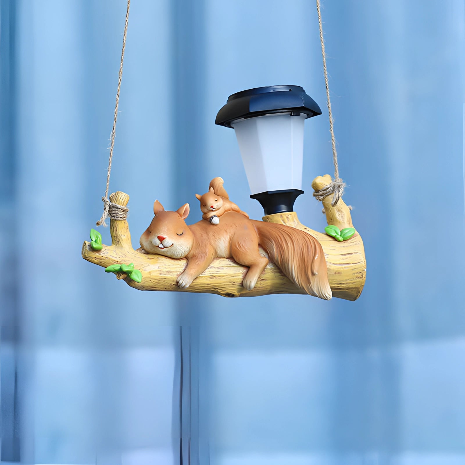 Squirrel-shaped solar garden lamp featuring an LED light, designed for outdoor use, resembling a whimsical animal figure.