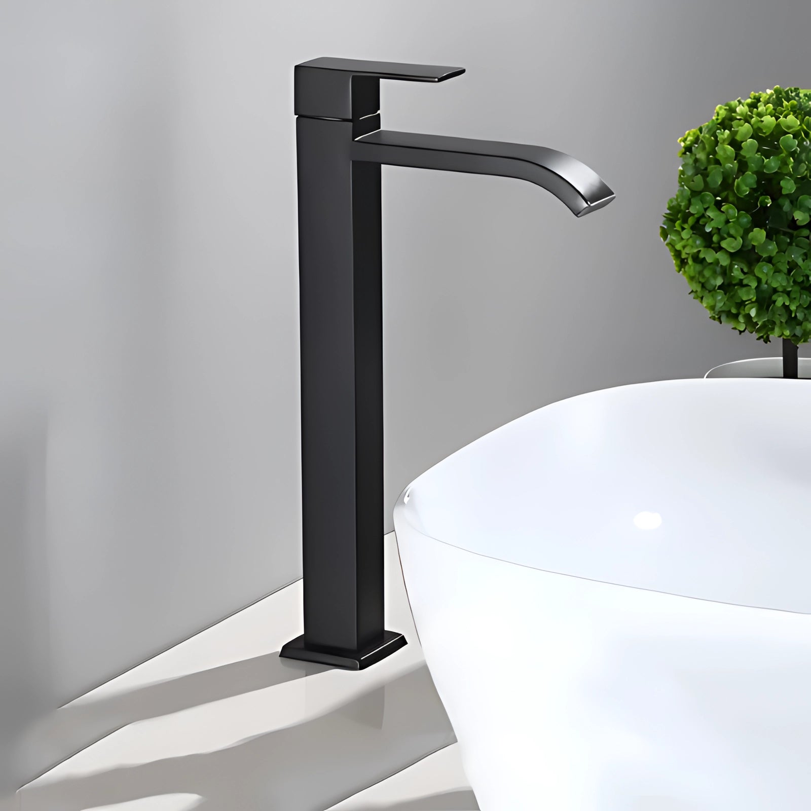 Tall black matte single-handle bathroom faucet with a sleek square design, suitable for vessel sinks.