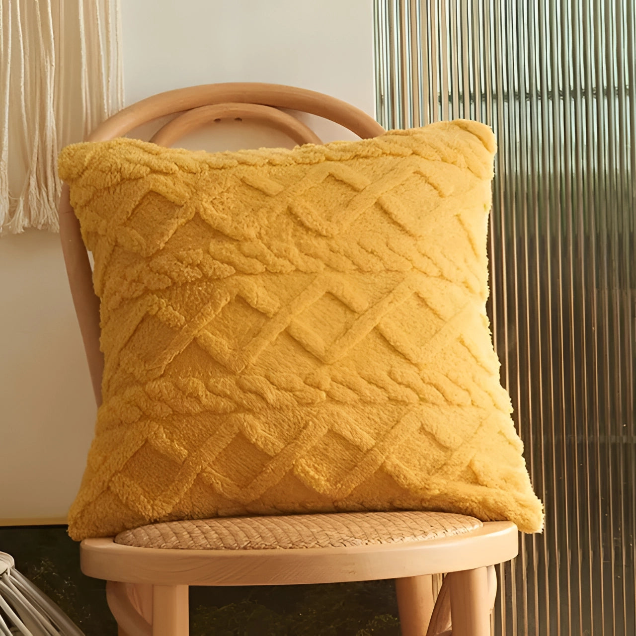 Textured velvet throw pillows in a geometric multi-color design, primarily featuring ginger yellow tones, displayed as a set of six pieces on a hardwood floor.