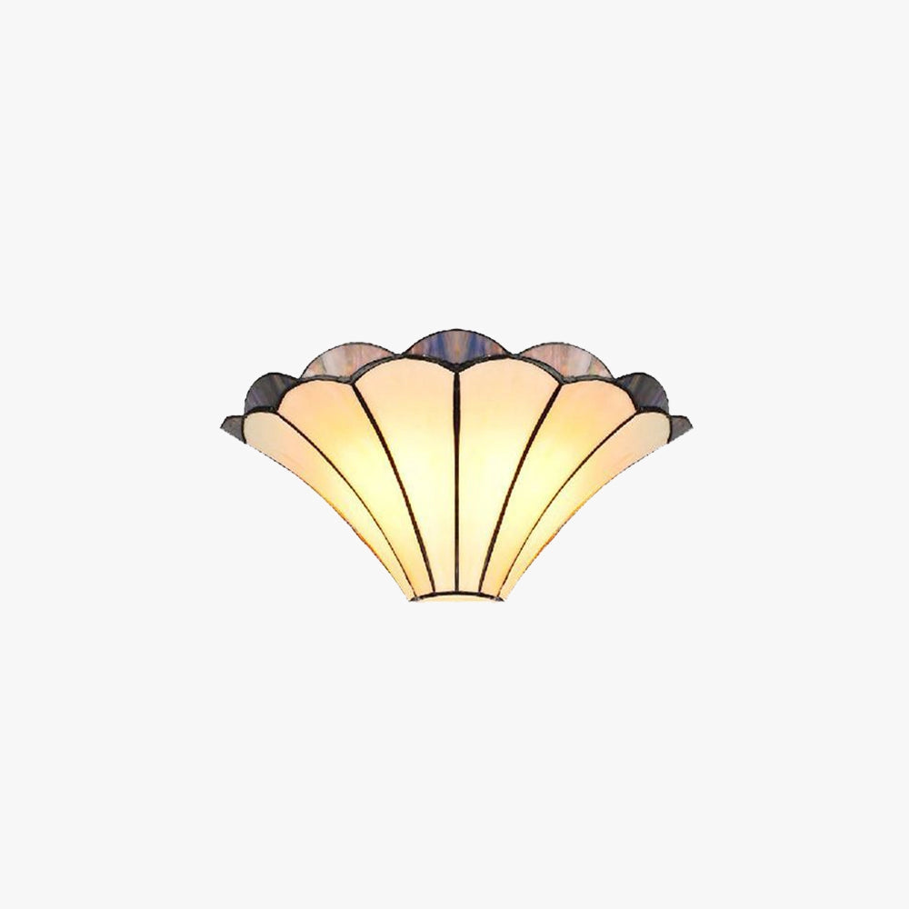 Tiffany-style stained glass shell wall sconce with an art deco design showcasing vibrant tints and shades, featuring intricate patterns and textures in a lighting accessory.