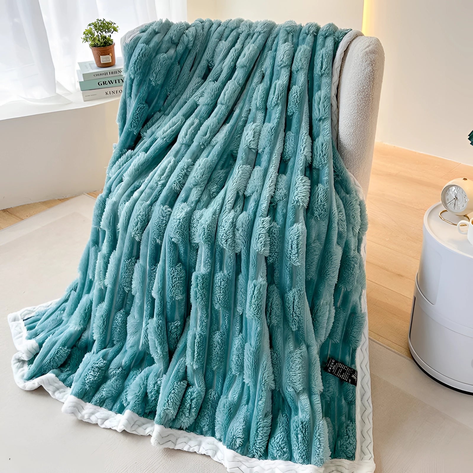 
A luxurious turquoise chunky knit blanket with a plush braided design, displayed in a rectangular shape, featuring shades of azure and aqua.