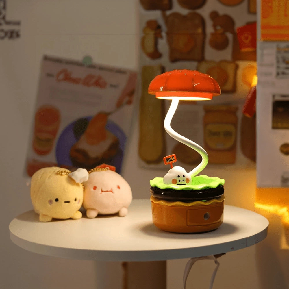 Whimsical mushroom-shaped LED lamp with a cute and colorful design, ideal for desk or nursery decor, resembling a charming dessert or baked good.