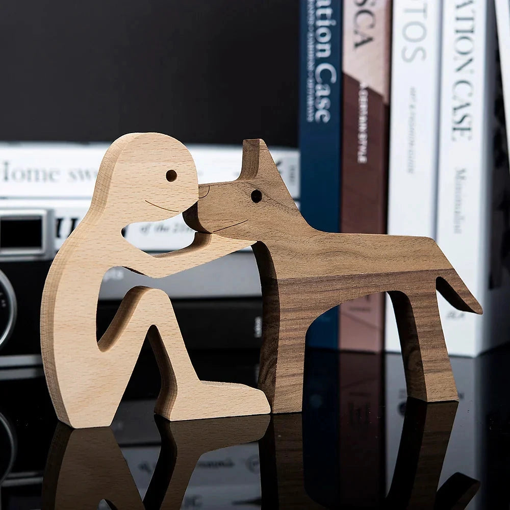 
A wooden dog sculpture adorned with a striped scarf, designed as a festive holiday figurine displayed on a shelf.