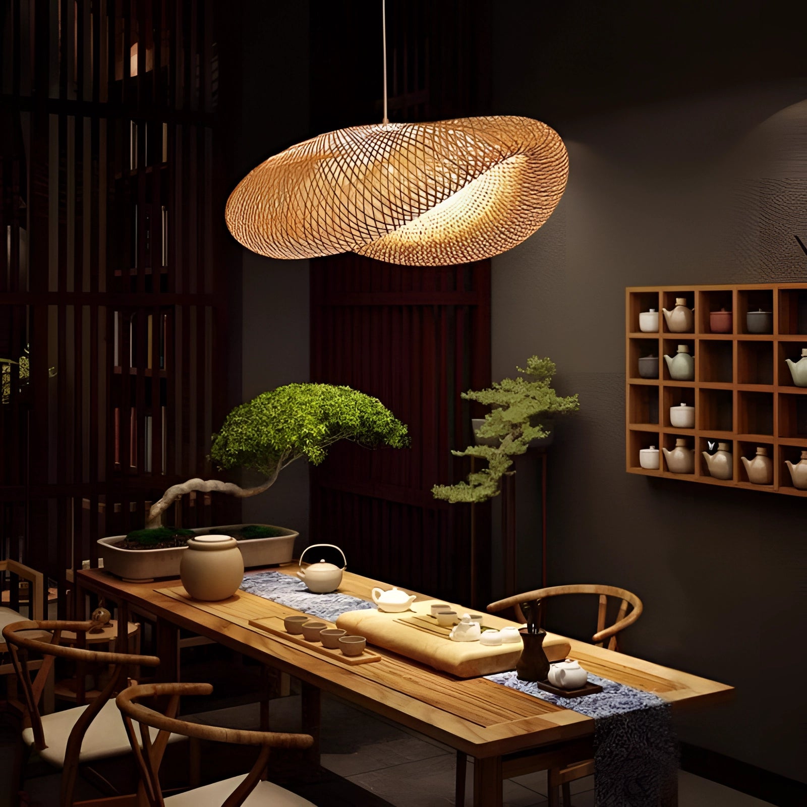 Handmade natural fiber woven LED pendant light hanging in a beautifully designed interior with wooden furniture, a table, and a plant, providing eco-friendly decor and ambient lighting.