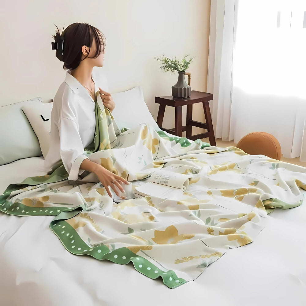 Yellow Flower Cooling Blanket made of luxury cotton featuring a botanical design, displayed neatly on a bed.