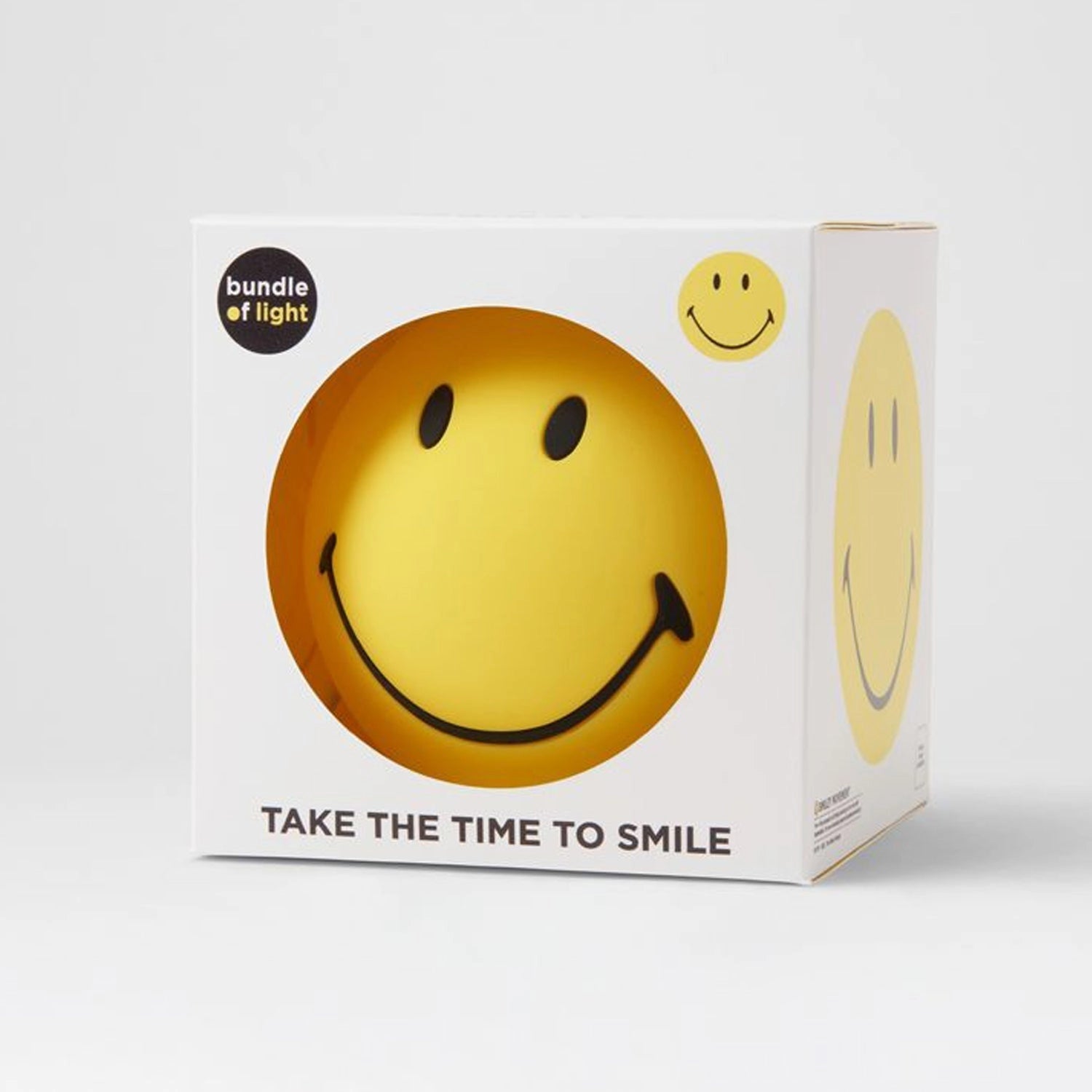 Yellow smiley face stress ball with a happy emoticon and bold black smile, designed as a fun desk accessory and mood booster.