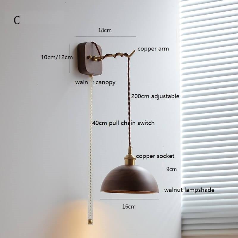 Walnut wooden wall lamp with copper arm and adjustable height.