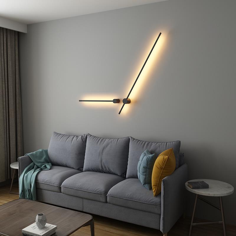 SleekLine LED Illuminator elegantly hung vertically in a modern living room, emitting a warm glow.